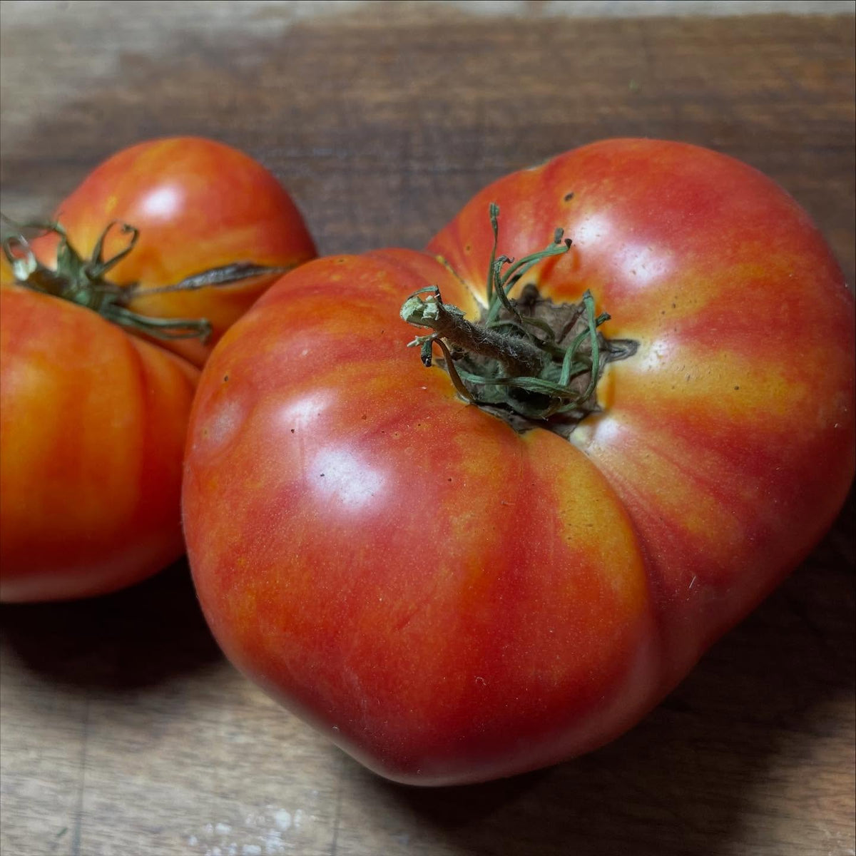 couple of large bicolour tomatoes, northern lights, and last ones are pineapple, image 2 of 4