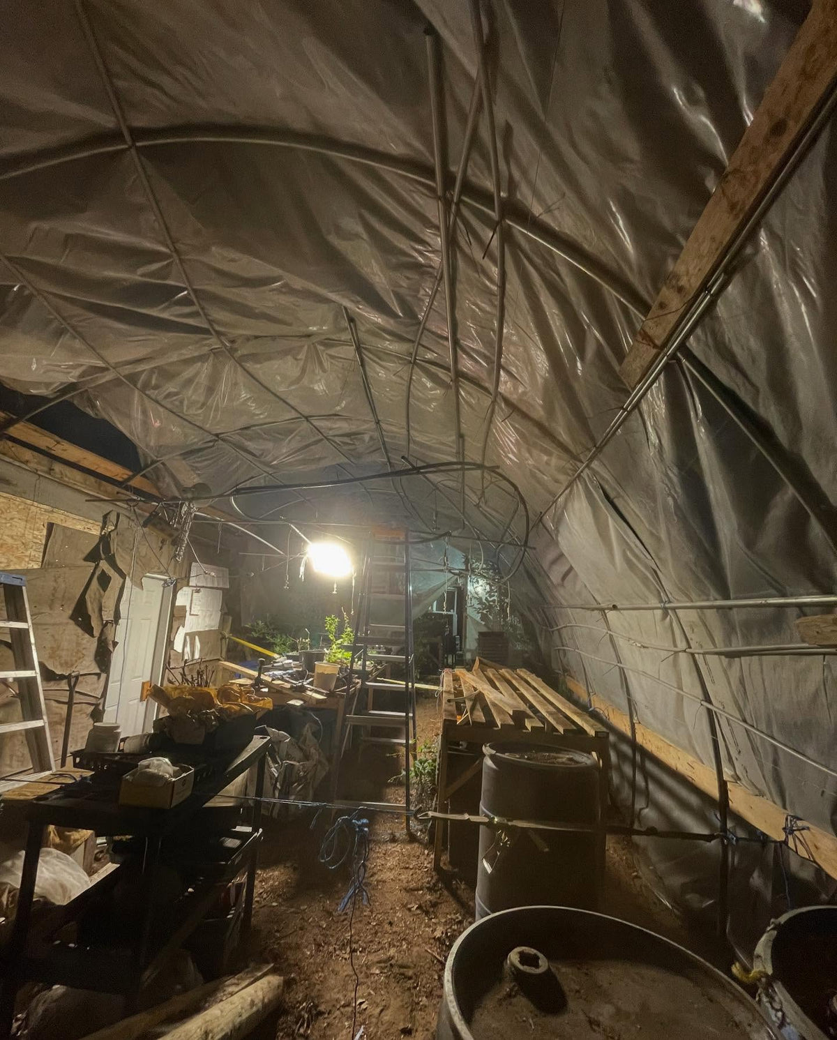 greenhouse reno in progress, the snow load this past winter had shifted some of the hoops, so they're now all adjusted