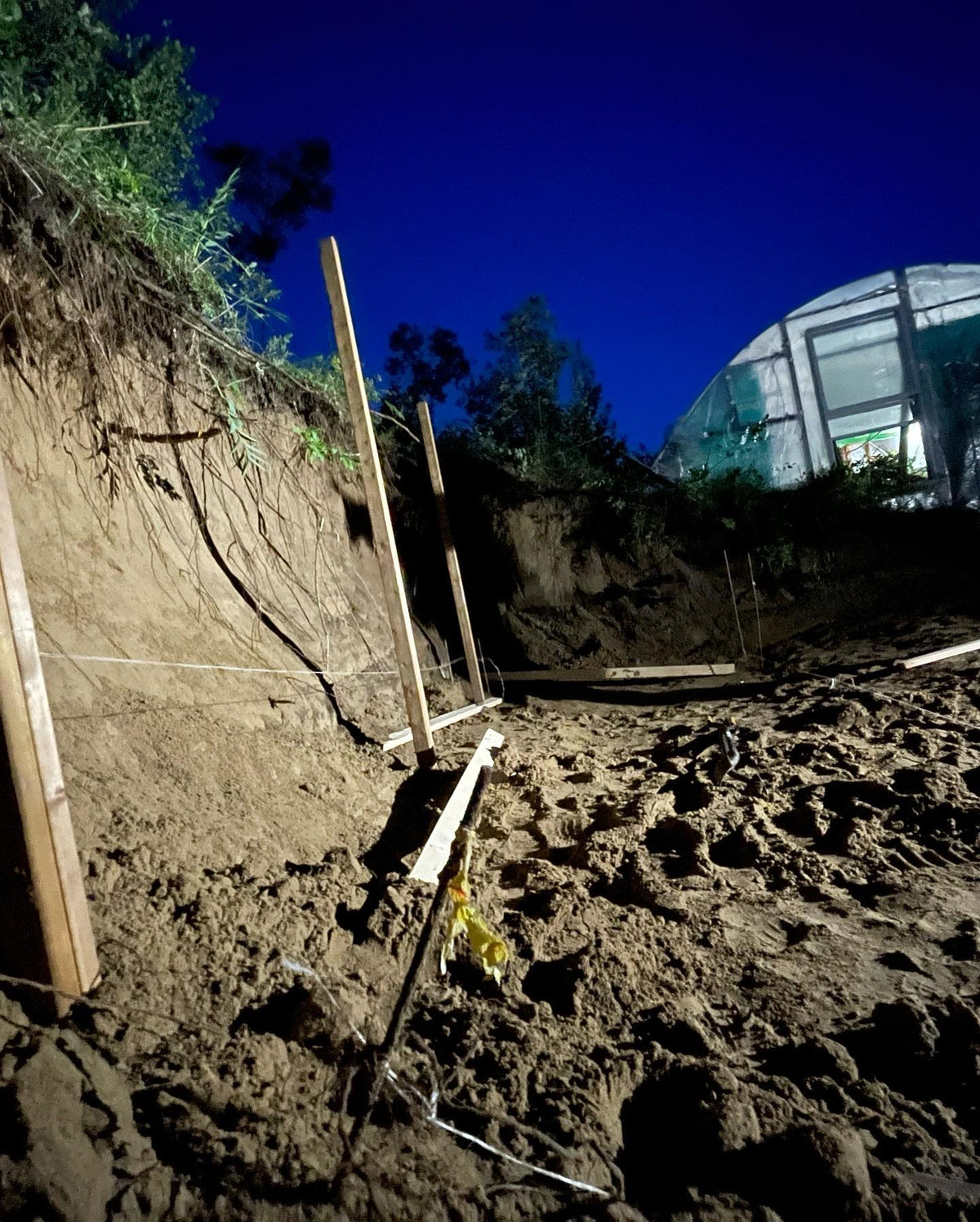 hillside excavation for our greenhouse expansion and root cellar finished up last night, image 2 of 2