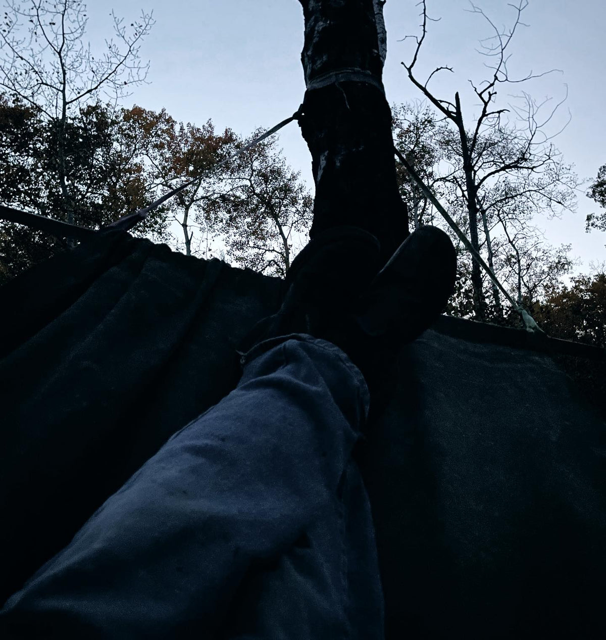 old hammock made from some salvaged military tent canvas, four years left out all winter and still hanging in there